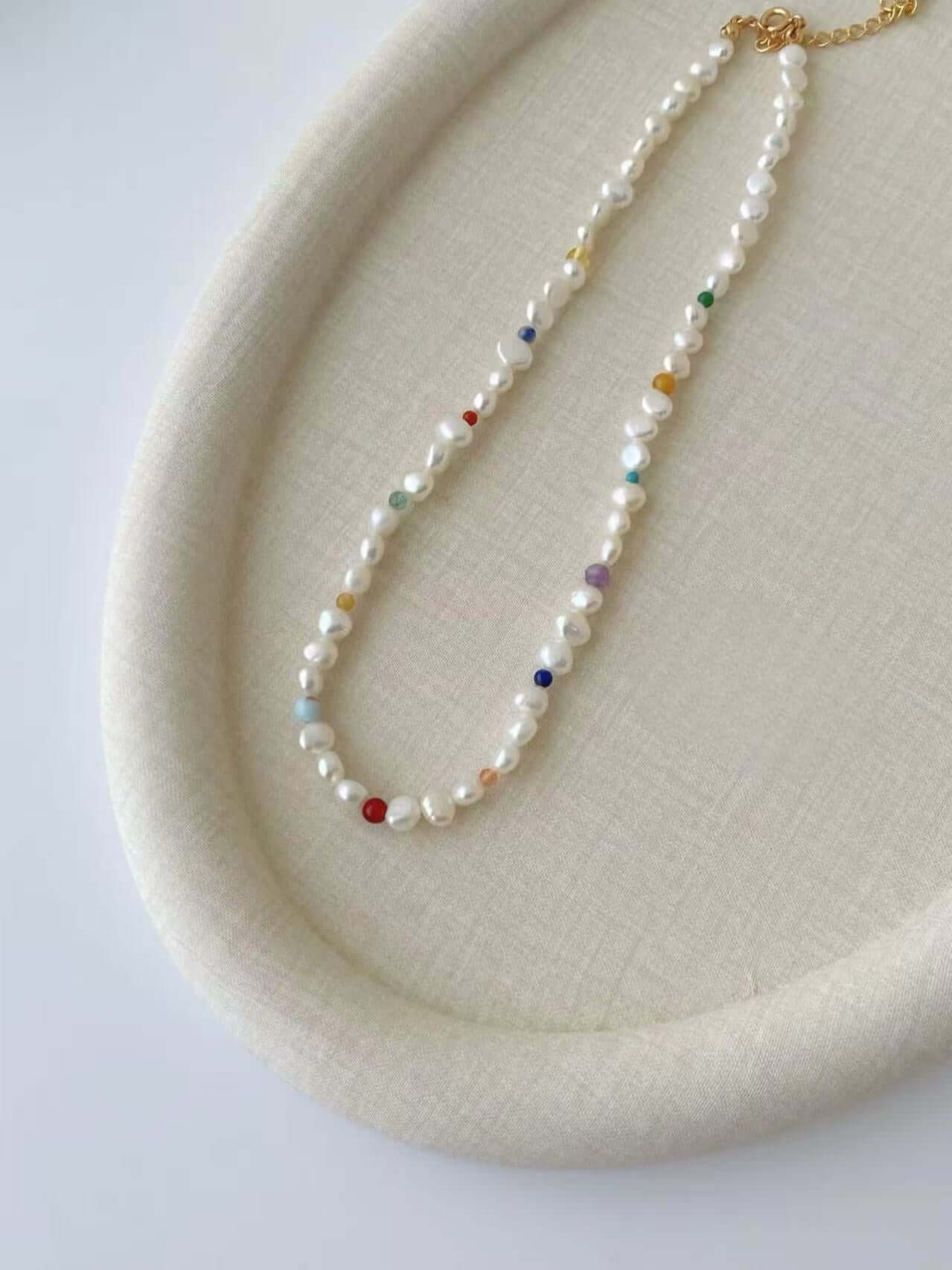 RXYjewelry Elegant pearl necklace and bracelet with subtle rainbow-hued accents and classic gold hardware