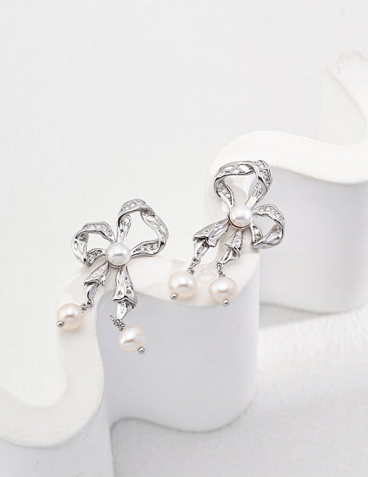 Natural pearl bow shape earrings – elegant design by RXY Jewelry